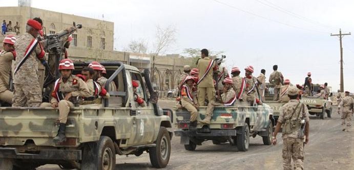 Soldiers loyal to Yemen's President Abd-Rabbu Mansour Hadi ride at the back of a pick-up truck during a parade in Marib province, east of the capital, Sanaa, on May 25, 2015. Rebel forces and loyalist fighters were locked in fierce fighting in Yemen as hopes of a political solution faded after the United Nations postponed peace talks. AFP PHOTO / STR (Photo credit should read STR/AFP/Getty Images)