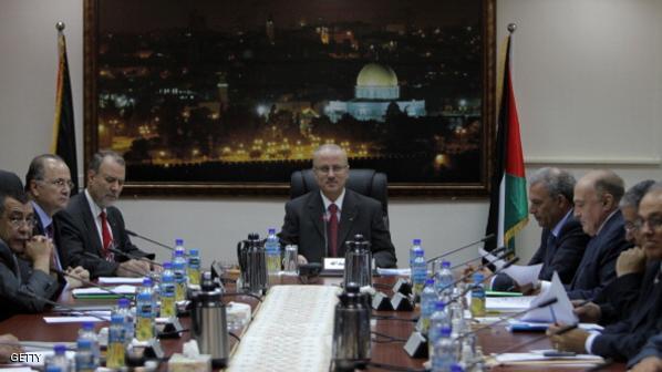 Palestinian Prime Minister Rami Hamdallah (C) chairs the first working meeting of the new Palestinian government in the West Bank town of Ramallah on June 11, 2013. The new government was sworn in on June 6, after the resignation of premier Salam Fayyad in April. AFP PHOTO/ABBAS MOMANI (Photo credit should read ABBAS MOMANI/AFP/Getty Images)