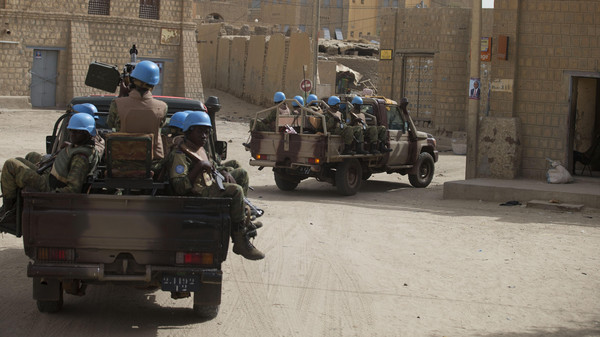 United Nations peacekeepers from Burkina Faso patrol through Timbuktu, Mali, Tuesday, July 23, 2013. Mali's presidential election is going ahead on Sunday despite massive logistical and technical lapses, including a voter roll which inexplicably does not contain the names of tens of thousands of registered voters.(AP Photo/Rebecca Blackwell)