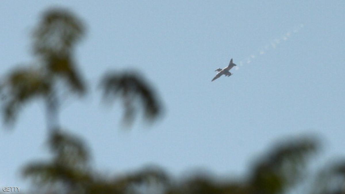 A Syrian army fighter jet flies over in Al-Bab, 30 kilometres from the northeastern Syrian city of Aleppo, on October 17, 2012. Rebels downed a helicopter in fierce fighting with troops seeking to retake a key Syrian town, a watchdog said, as peace envoy Lakhdar Brahimi warned the conflict risks setting the region ablaze. AFP PHOTO/TAUSEEF MUSTAFA (Photo credit should read TAUSEEF MUSTAFA/AFP/Getty Images)