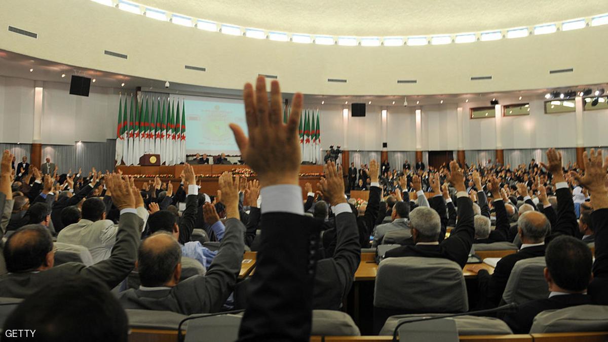 Algerian Parliament and Council of Nation membrs vote "yes" for controversial constitutional amendments during a special session meeting, on Novemeber 12, 2008. Algeria's parliament approved controversial constitutional amendments which will allow veteran President Abdelaziz Bouteflika to serve a third term. A combined total of 500 members of the upper and lower houses of parliament approved the amendments to the former French colony's constitution while only 21 voted against. There were eight abstentions. AFP PHOTO/FAYEZ NURELDINE (Photo credit should read FAYEZ NURELDINE/AFP/Getty Images)