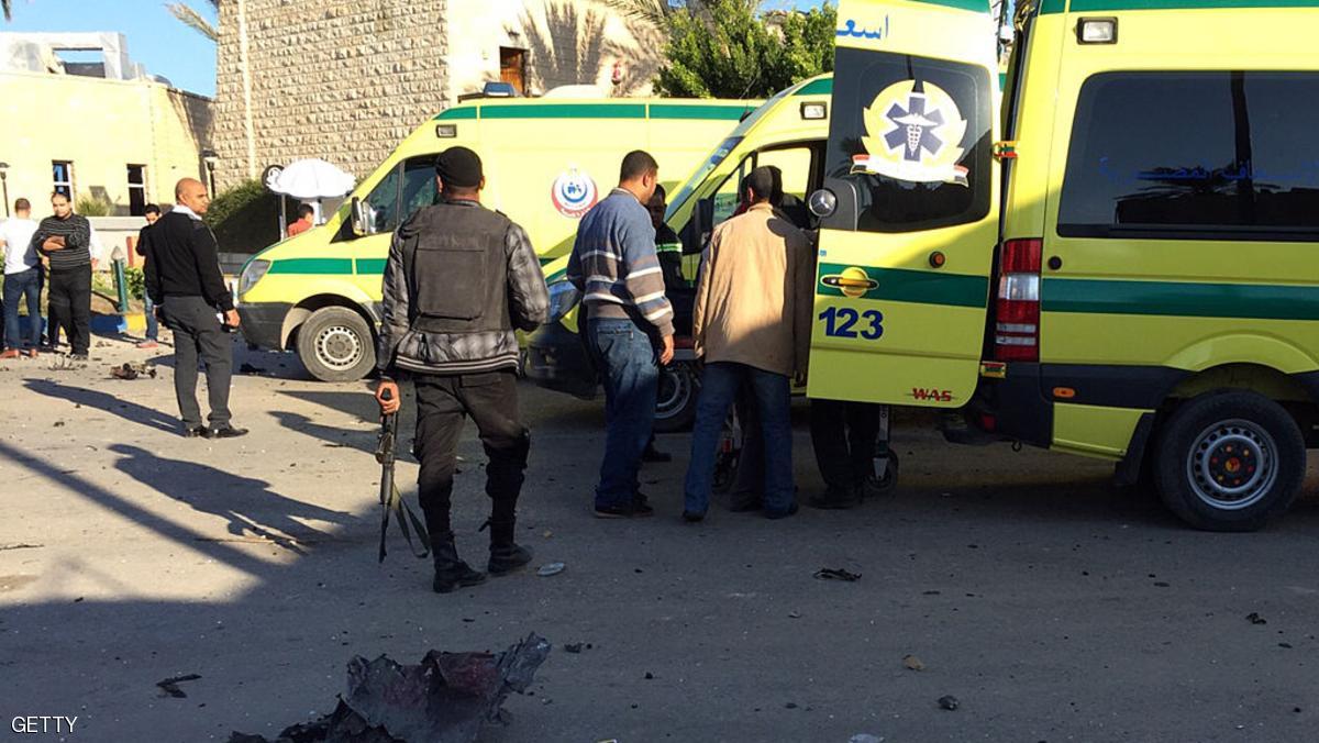 Emergency personnel and security forces stand next to ambulances outside the Swiss Inn hotel in the Egyptian town of El-Arish, in the Sinai peninsula, following an attack on the hotel by two suicide bombers and a gunman on November 24, 2015. The attackers killed four people, including a judge, in the assault on the hotel hosting judges overseeing Egypt's parliamentary polls, the government said. AFP PHOTO / STR / AFP / - (Photo credit should read -/AFP/Getty Images)