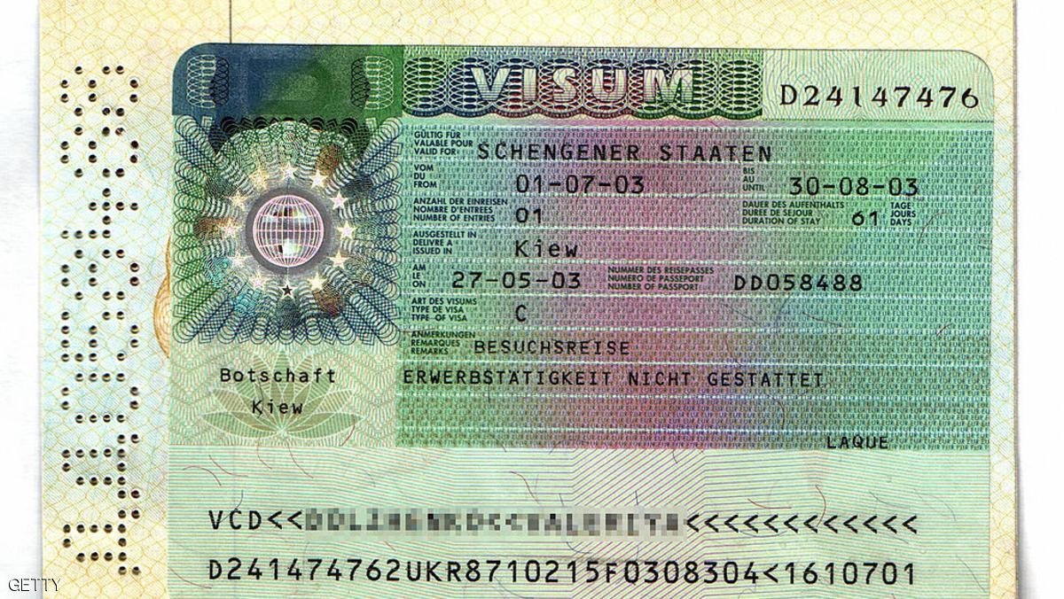 KIEV, UKRAINE: A picture taken 22 April 2005 of a Schengen visa granted to a female Ukranian by the German embassy in Kiev in May 2003. German Foreign Minister Joschka Fischer will fight for his political life 25 April 2005 when he defends his role in an immigration scandal which allegedly saw criminals flood into the country. The charismatic Fischer will testify before a parliamentary investigation seeking to establish how relaxing the rules for issuing visas led to tens of thousands of eastern Europeans coming to Germany between 2000 and 2003. AFP PHOTO SERGEI SUPINSKY (Photo credit should read SERGEI SUPINSKY/AFP/Getty Images)