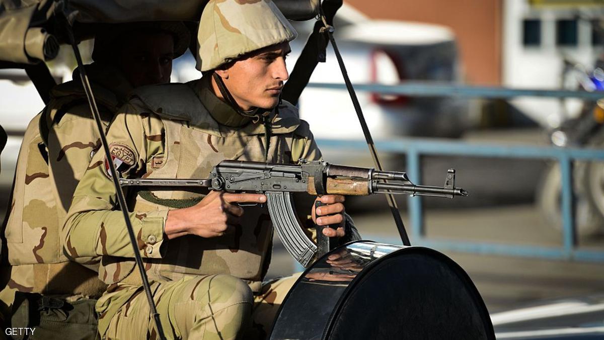 An Egyptian member of the armed forces patrols outside al-Maza military airport where the bodies of the members of security forces, who were killed in North Sinai province during an attack the day before, had been flown on January 30, 2015 in the capital Cairo. Jihadists targeted security forces on January 29, 2015 with rockets at a police headquarters, a military base and a residential complex for security forces and a car bomb in North Sinai province in simultaneous attacks claimed by an affiliate of the Islamic State group. Egypt's army clashed with jihadists in Sinai on January 30, 2015, leaving two children dead, as President Abdel Fattah al-Sisi flew home to deal with a wave of militant attacks that killed at least 30 people. AFP PHOTO / MOHAMED EL-SHAHED (Photo credit should read MOHAMED EL-SHAHED/AFP/Getty Images)