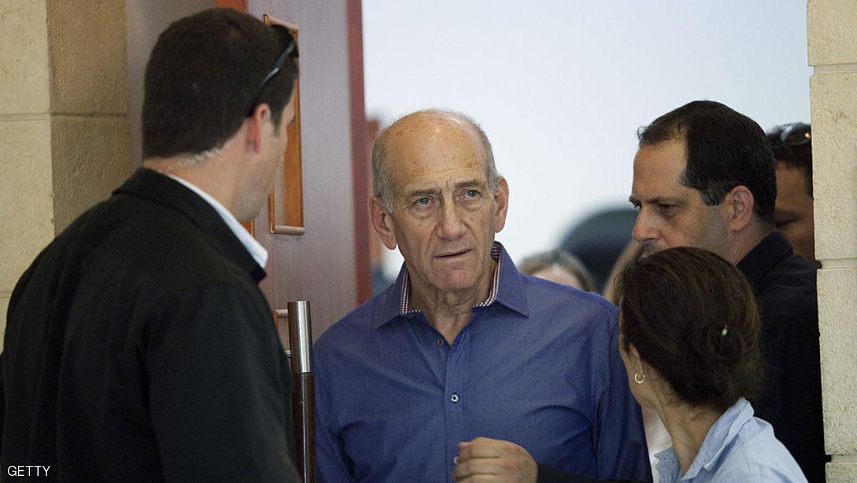 JERUSALEM, ISRAEL - SEPTEMBER 24: Former Israeli Prime Minister Ehud Olmert (2nd L) walks out of his sentencing hearing for a corruption case at Jerusalem's District Court September 24, 2012 in Jerusalem, Israel. According to reports, Olmert received a light sentence, a suspended one-year sentence and a $18, 000 fine for his conviction in the corruption case that forced him from office. (Photo by Abir Sultan-Pool/Gett Images)