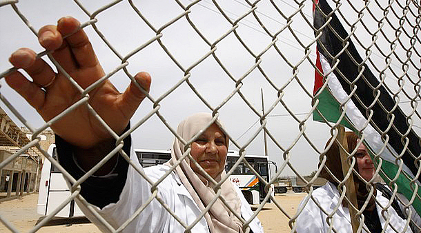 Palestinian doctors demonstrate in front of the Rafah border crossing with Egypt on April 27, 2011demanding the end of the siege by Israel on the Gaza Strip and the opening of the Rafah crossing. AFP PHOTO / SAID KHATIB (Photo credit should read SAID KHATIB/AFP/Getty Images)