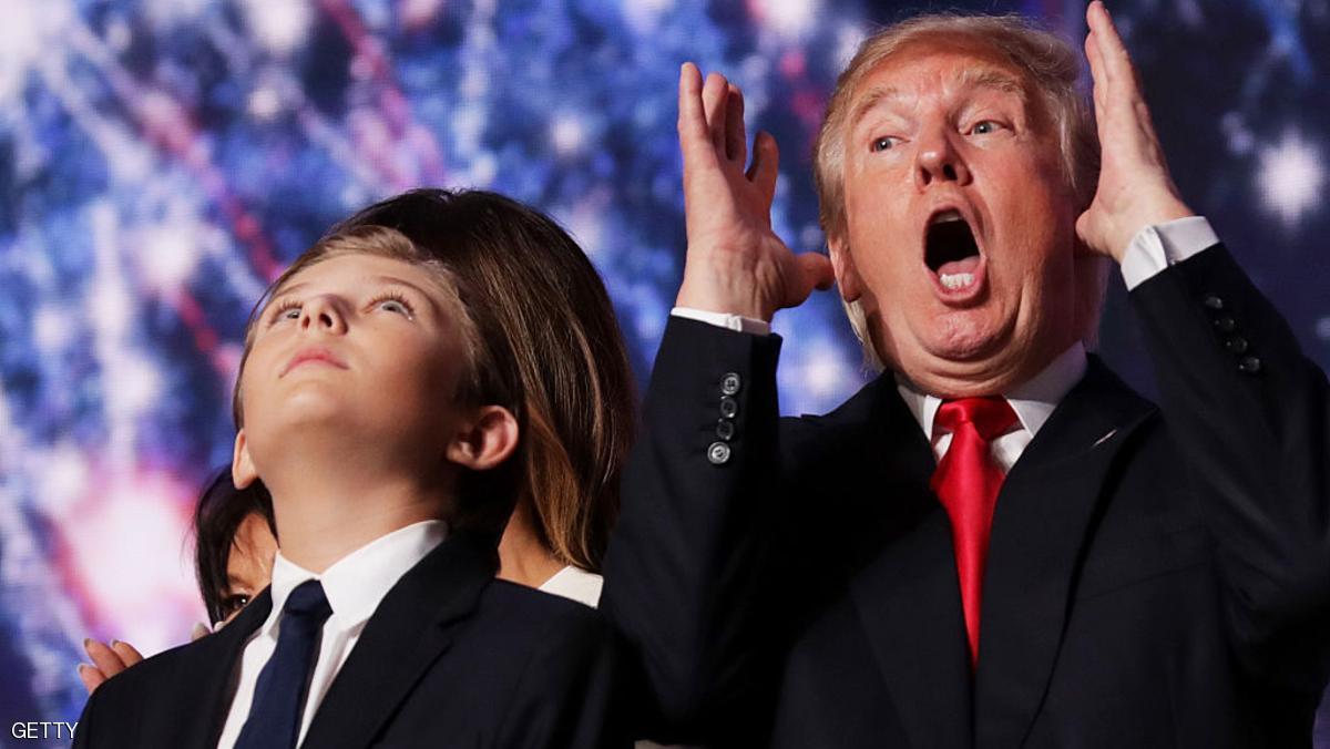 CLEVELAND, OH - JULY 21: Republican presidential candidate Donald Trump reacts as his son Barron Trump looks on at the end of the Republican National Convention on July 21, 2016 at the Quicken Loans Arena in Cleveland, Ohio. Republican presidential candidate Donald Trump received the number of votes needed to secure the party's nomination. An estimated 50,000 people are expected in Cleveland, including hundreds of protesters and members of the media. The four-day Republican National Convention kicked off on July 18. (Photo by Chip Somodevilla/Getty Images)