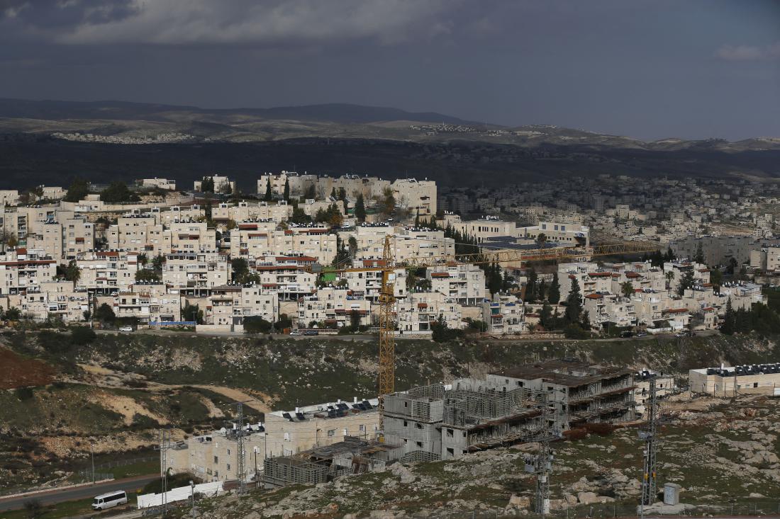 A general view shows construction in the Jewish settlement of Pisgat Zeev (foreground), in east Jerusalem, on January 15, 2016. / AFP / AHMAD GHARABLI (Photo credit should read AHMAD GHARABLI/AFP/Getty Images)