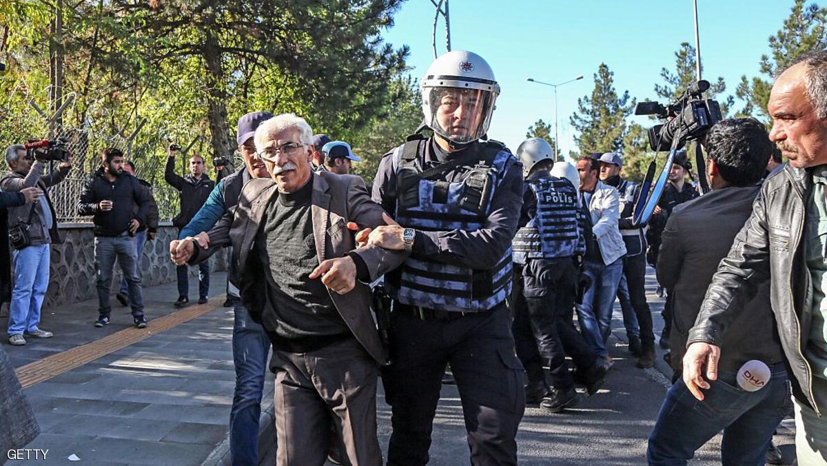 Turkish anti riot police officers detain a protestor on November 4, 2016 in front of the courthouse in the southeastern Turkish city of Diyarbakir during a demonstration after police detained the two co-leaders of the country's main pro-Kurdish party and several other MPs. The EU on November 4 warned Turkey to respect democratic norms when fighting Kurdish rebels and said it was "gravely concerned" by the arrest of leaders of the country's main pro-Kurd party. Eight people were killed, over 100 wounded in a blast outside a police building on November 4 in Diyarbakir, the centre of the Kurdish minority, medical sources told AFP. The explosion occurred just hours after police detained the two co-leaders of the country's main pro-Kurdish party and several other MPs in a major escalation of a broader crackdown against leading Kurds. / AFP / ILYAS AKENGIN (Photo credit should read ILYAS AKENGIN/AFP/Getty Images)