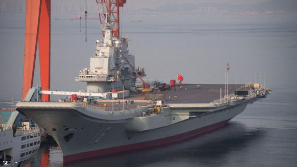 To go with China-Japan-US-maritime-defence,FOCUS by Sebastien Blanc
This photo taken on July 6, 2014 shows the Chinese aircraft carrier Liaoning docked at the seaport city of Dalian in northeast China's Liaoning province. The 300-metre (1,000-foot) Liaoning -- a Soviet-era vessel Beijing bought from Ukraine -- was commissioned in September 2012, and officers have acknowledged that it is not yet ready for combat, with naval fighter pilots taking years to train. CHINA OUT AFP PHOTO (Photo credit should read STR/AFP/Getty Images)