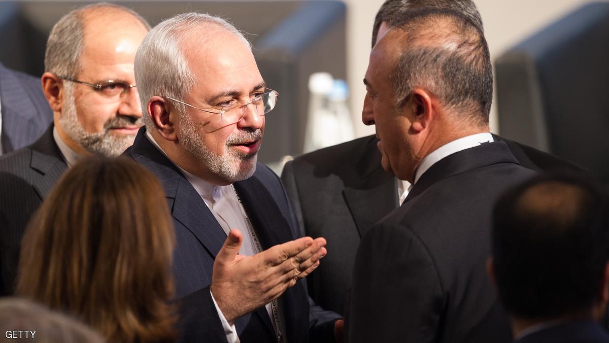 MUNICH, GERMANY - FEBRUARY 12: Mohammad Javad Zarif (C), Minister of Foreign Affairs of Iran, talks to turkish Minister of Foreign Affairs, Mevlut Cavusoglu (R) at the 2016 Munich Security Conference at the Bayerischer Hof hotel on February 12, 2016 in Munich, Germany. The annual event brings together government representatives and security experts from across the globe and this year the conflict in Syria will be the main issue under discussion. (Photo by Lennart Preiss/Getty Images)