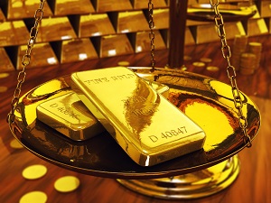 Gold ingots on brass scale ,3d illustration