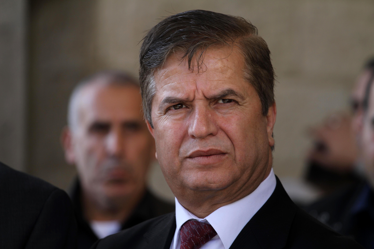 Palestinian minister of health Jawad Awwad, looks on upon his arrival with members of unity government to the Gaza Strip, in Gaza city on December 29, 2014. Around 50 Palestinian unity government officials, including eight ministers, arrived in Gaza Monday to kickstart reconstruction of the territory devastated by a 50-day war with Israel, officials said. Photo by Mohammed Asad