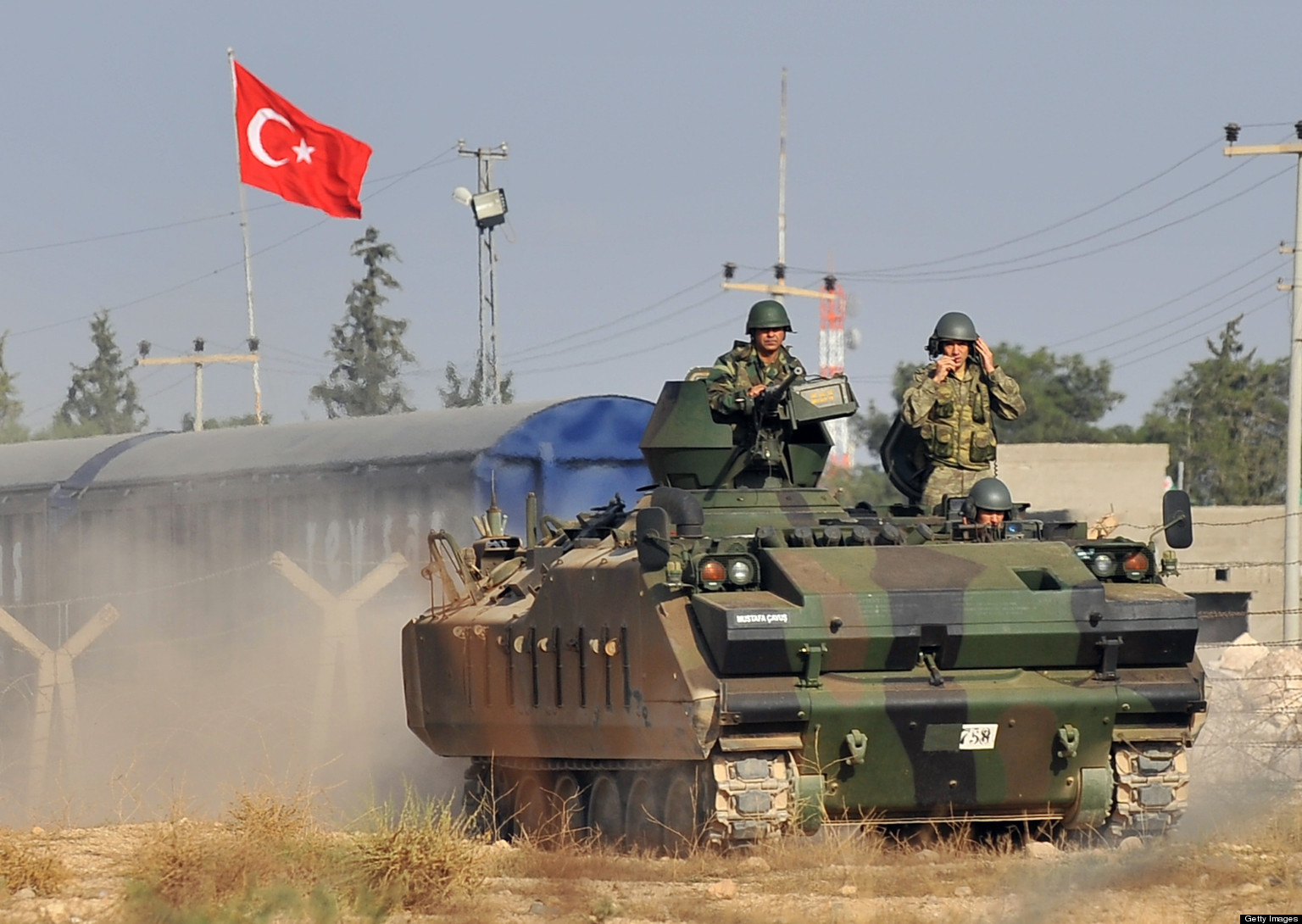 Turkish soldiers patrol the border town of Ceylanpinar at the Turkish-Syrian border, on November 11, 2012. The Syrian Observatory for Human Rights reported that Kurdish residents backed by militia from the Democratic Union Party (PYD) had taken control of three towns near the border with Turkey after convincing pro-government forces to leave. AFP PHOTO / BULENT KILIC (Photo credit should read BULENT KILIC/AFP/Getty Images)