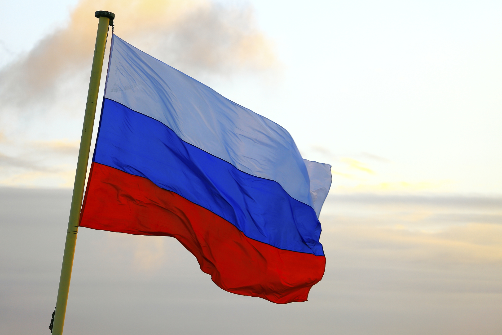 Flag of Russia waving in the wind on sunset, Moscow