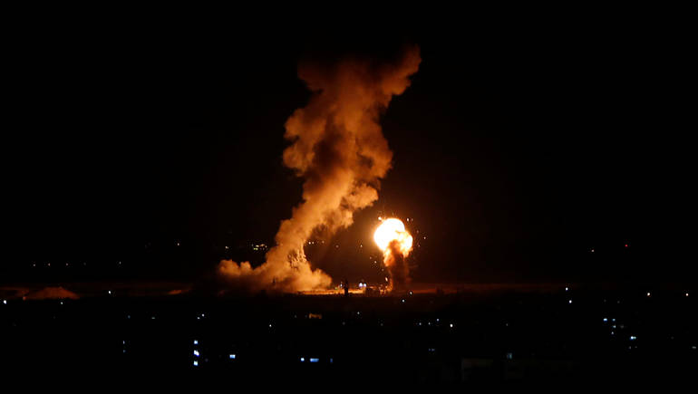 Smoke and flame are seen during an Israeli air strike in Gaza, November 12, 2018. REUTERS/Ahmed Zakot