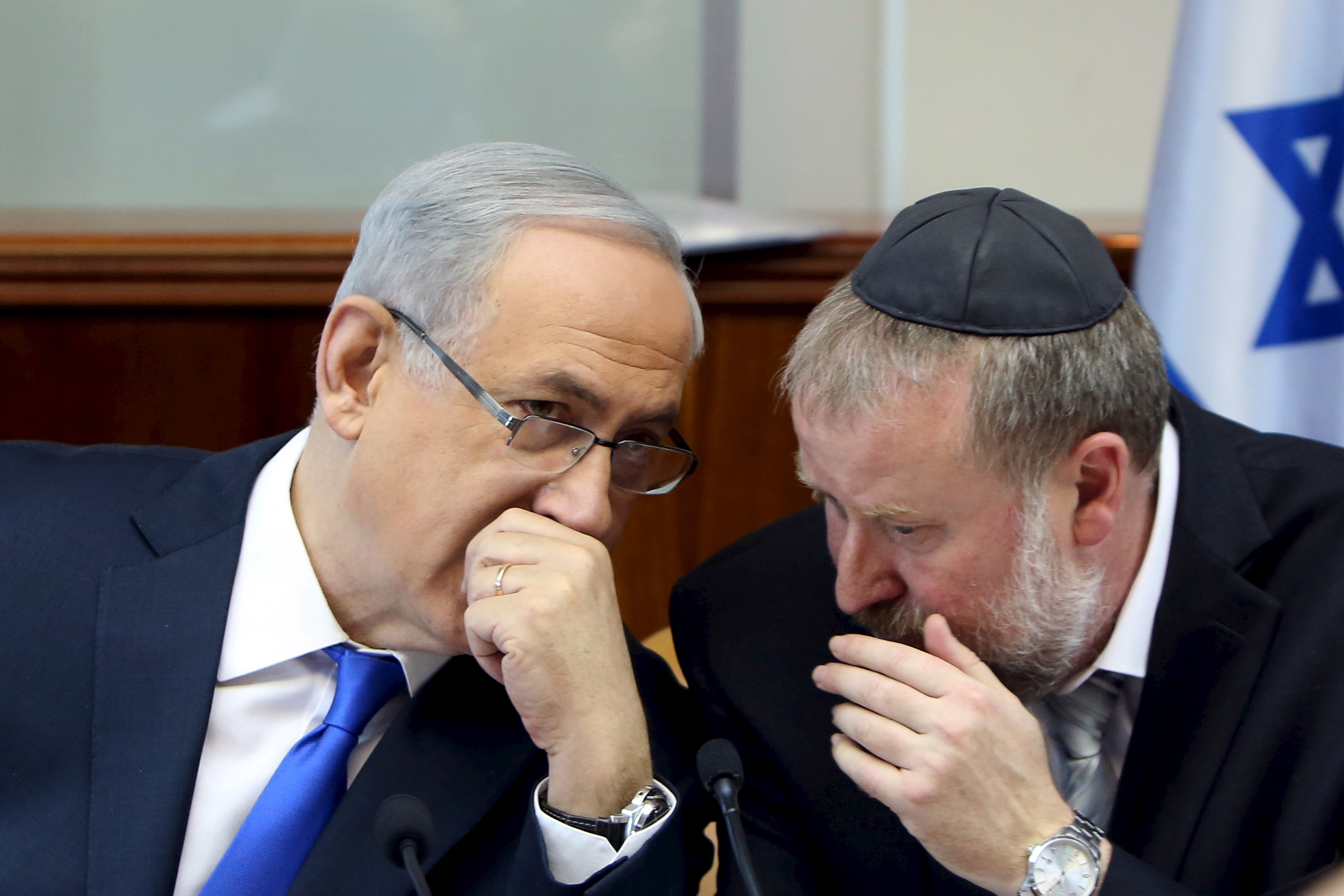 Israeli Prime Minister Benjamin Netanyahu (L) speaks with Cabinet Secretary Avichai Mandelblit during the weekly cabinet meeting in Jerusalem December 20, 2015. REUTERS/Gali Tibbon/Pool - GF10000271896