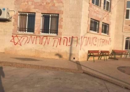 مستوطنون يخطون شعارات عبرية في سنجل