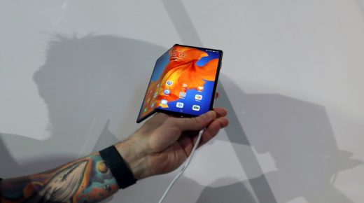 A man takes a picture of Huawei Mate Xs foldable smartphone during Huawei products launch event in Barcelona, Spain February 24, 2020. REUTERS/Nacho Doce