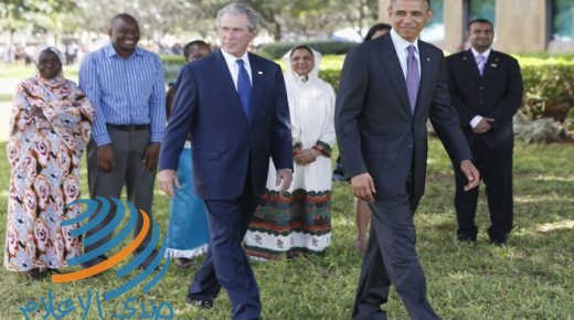 U.S. President Barack Obama (front, R) and former President George W. Bush (front, L) attend a memorial for the victims of the 1998 U.S. Embassy bombing in Dar es Salaam July 2, 2013. Behind them are the survivors of the attack. REUTERS/Jason Reed (TANZANIA - Tags: POLITICS)