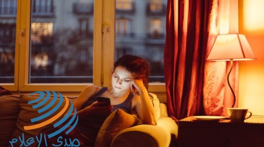 Unhappy woman at home text messaging