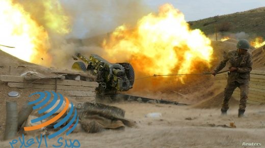 An ethnic Armenian soldier fires an artillery piece during a military conflict over the breakaway region of Nagorno-Karabakh, in this handout picture released October 5, 2020. Picture released October 5, 2020. Press office of Armenian Defense Ministry/PAN Photo/Handout via REUTERS ATTENTION EDITORS - THIS IMAGE HAS BEEN SUPPLIED BY A THIRD PARTY. MANDATORY CREDIT.