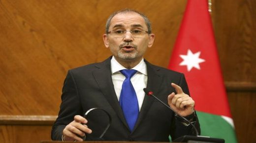 Jordanian Foreign Minister Ayman Safadi and Turkish Foreign Minister Mevlut Cavusoglu give a press conference in Amman, Jordan, Monday, Feb. 19, 2018. Cavusoglu said his country is ready to battle Syrian government troops if they enter an enclave in northern Syria to protect Syrian Kurdish fighters. Syrian state media said Sunday that pro-Syrian government forces will begin entering the Afrin enclave "within hours," after reaching an agreement with the Kurdish militia in control of the region. (AP Photo/Raad Adayleh)