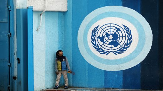 A Palestinians boy sits near the headquarters United Nations Relief and Works Agency (UNRWA) in Gaza city on January 6, 2018. US envoy to the UN Haley warned US support for UNRWA would end if the PA refuses to enter negotiations with Israel. Despite Mr. Trumps Twitter message, Chris Gunness, an Unrwa spokesman, said the agency had not received any formal notification that the Trump administration intended to cut its funding. The United States is the top funder of Unrwa, and according to figures released in 2016, it contributed nearly $369 million. Photo by Ashraf Amra