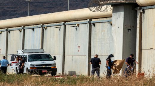 Israeli security personnel stand together outside the walls of Gilboa prison after six Palestinian militants broke out of it in north Israel September 6, 2021. REUTERS/ Gil Eliyahu