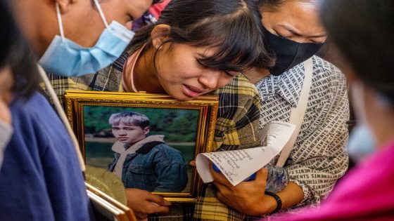 A relative cries during the funeral of a protester, who died amid a crackdown by security forces on demonstrations against the military coup, in Taunggyi in Myanmar's Shan state on March 29, 2021. (Photo by STR / AFP)