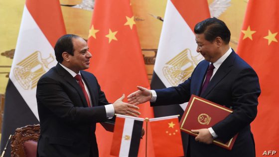 Egypt's President Abdel Fattah al-Sisi (L) shakes hands with Chinese President Xi Jinping during a signing ceremony at the Great Hall of the People in Beijing on December 23, 2014. Sisi is on a state visit to China. AFP PHOTO / POOL / GREG BAKER