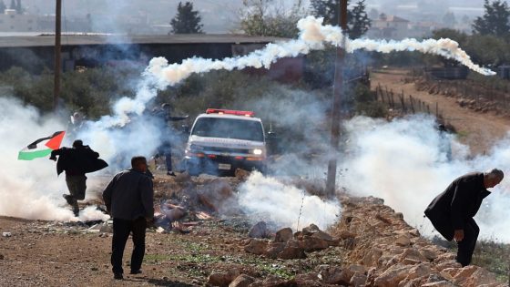 Palestinian demonstrators clash with Israeli soldiers during a protest against the establishment of Israeli outposts, in Beit Dajan, east of the occupied West Bank city of Nablus, on December 16, 2022. (Photo by JAAFAR ASHTIYEH / AFP)