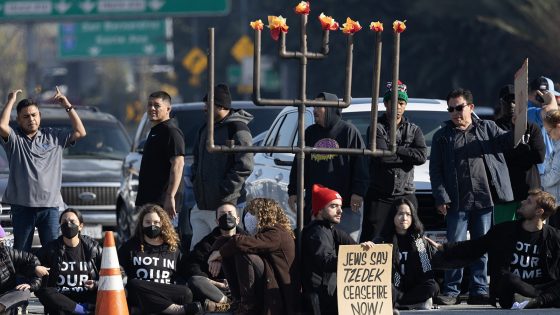 LOS ANGELES, CA - DECEMBER 13: Demonstrators block the 110 freeway in downtown on Wednesday, Dec. 13, 2023 in Los Angeles, CA to call for a ceasefire in the Israeli-Hamas conflict. (Myung J. Chun / Los Angeles Times via Getty Images)