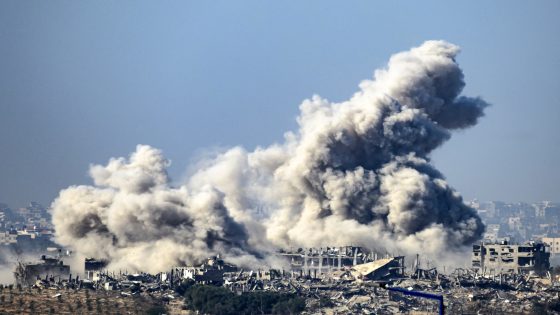 This picture taken from southern Israel near the border with the Gaza Strip shows smoke rising from buildings after being hit by Israeli strikes, as battles resume between Israel and Hamas militants, on December 1, 2023. - A temporary truce between Israel and Hamas expired on December 1, with the Israeli army saying combat operations had resumed, accusing Hamas of violating the operational pause. (Photo by John MACDOUGALL / AFP)