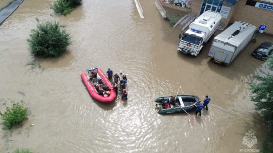 Rescuers use inflatable boats to evacuate residents of the area flooded due to a dam break in Ussuriysk, Russia, in this still image taken from video released August 12, 2023. Russian Emergencies Ministry/Handout via REUTERS