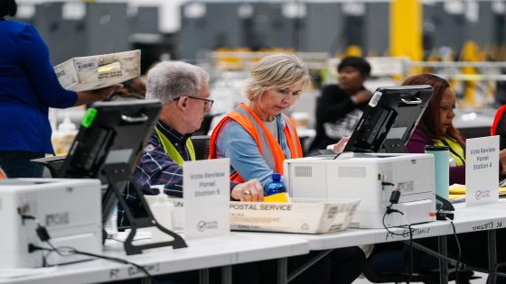 Bipartisan vote review pairs look over ballots at the new Fulton County Elections Hub and Operations Center on November 4, 2024, in Union City, Georgia. - US Vice President Kamala Harris and former president Donald Trump are hurtling toward their November 5 election showdown, one of the closest contests in modern American history. (Photo by Elijah Nouvelage / AFP)