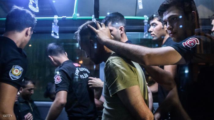 TOPSHOT - EDITORS NOTE: Graphic content / Turkish anti riot police officers detain a Turkish soldier who allegedly took part in a military coup as they are leaving in a bus the courthouse at Bakirkoy district in Istanbul on July 16, 2016. President Recep Tayyip Erdogan battled to regain control over Turkey on July 16, 2016 after a coup that claimed more than 250 lives, bid by discontented soldiers, as signs grew that the most serious challenge to his 13 years of dominant rule was faltering. / AFP / OZAN KOSE (Photo credit should read OZAN KOSE/AFP/Getty Images)