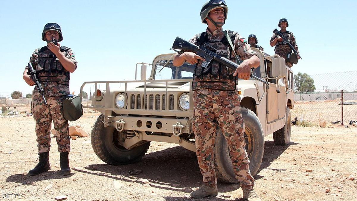Jordanian soldiers stand guard near their vehicle as they secure the area near the Al-Karameh border point with Iraq on June 25, 2014 as Jordan reinforced its border with Iraq after Sunni Arab militants overran a crossing with Syria. Sunni insurgents led by the jihadist Islamic State of Iraq and the Levant (ISIL) overran swathes of land north and west of Baghdad this month sparking fears in Amman that they will take the fight to Jordan, which is already struggling with its own home-grown Islamists. AFP PHOTO/STR (Photo credit should read -/AFP/Getty Images)