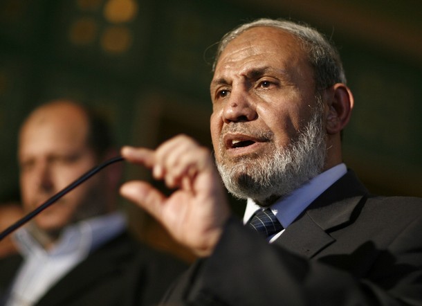 The leader of the Palestinian Islamic movement Hamas Mahmud Zahar speaks to the press as Arab League Secretary General Amr Mussa (unseen) listens on, in Cairo, on March 29, 2011, at the Arab league headquarters. AFP PHOTO/STR (Photo credit should read -/AFP/Getty Images)