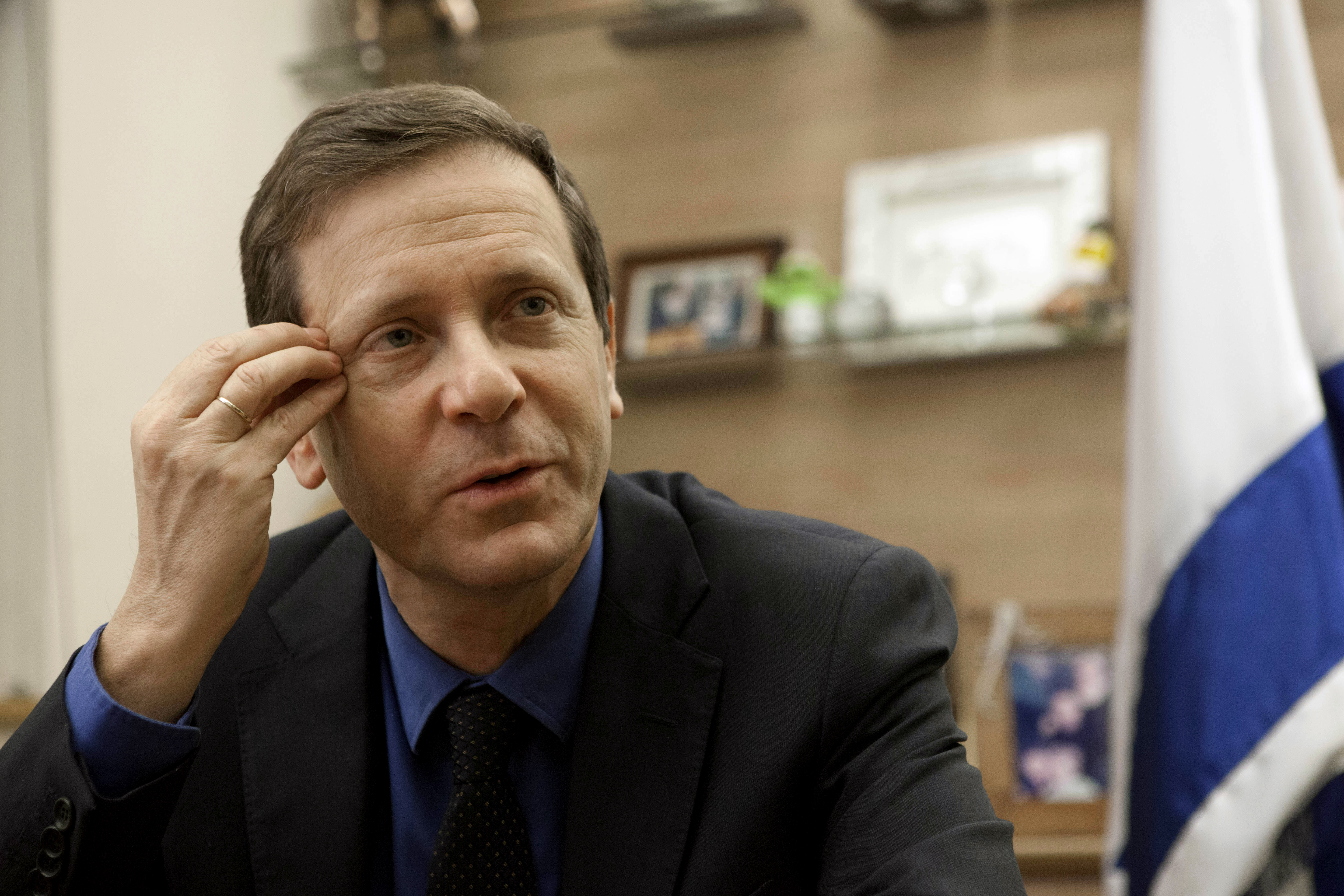 Isaac Herzog, a newly elected leader of the Labor Party gestures during an interview in his office in Jerusalem, Wednesday, Dec. 11, 2013. Herzog said Wednesday that Benjamin Netanyahus views on a peace deal with the Palestinians remain an enigma, and that hes not sure the Israeli prime minister has the "mental willingness'' to do what is needed. (AP Photo/Dan Balilty)