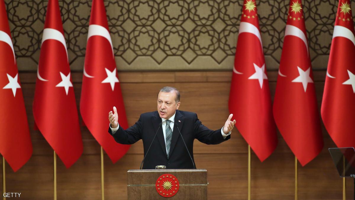 Turkish President Tayyip Erdogan gestures during his speech with mukhtars or local village and town leaders at the Presidential Palace in Ankara, on May 4, 2016. / AFP / ADEM ALTAN (Photo credit should read ADEM ALTAN/AFP/Getty Images)