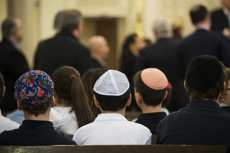 NEW YORK, NY - MARCH 3: Students from a local Jewish school take their seats to listen to U.S. Rep. Carolyn Maloney (D-NY) speak about the rise in hate crimes against the Jewish and Muslim communities at the Park East Synagogue, March 3, 2017 in New York City. Earlier on Friday morning in St. Louis, Federal Bureau of Investigation (FBI) authorities arrested Juan Thompson, who is alleged to have recently made numerous threats against Jewish community centers, Jewish schools, a Jewish museum and the Anti-Defamation League. Drew Angerer/Getty Images/AFP