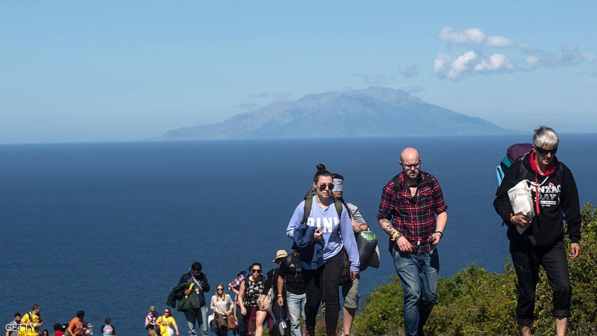 ECEABAT, TURKEY - APRIL 25: Australians and New Zealanders are seen walking on second ridge road to the New Zealand Memorial service at Chunuk Bair after attending the morning's dawn service on April 25, 2016 in Eceabat, Turkey. Turkish and Allied powers representatives, as well as family members of those who served, are commemorating the 101st anniversary of the Gallipoli campaign with ceremonies across the Gallipoli Peninsula. The Gallipoli land campaign, began on April, 25, 1915 and saw a combined Allied force of British, French, Australian, New Zealand and Indian troops in an offensive to occupy the Gallipoli Peninsula and the Dardanelles Strait. The campaign lasted 8 months and cost the Allies approximately 50,000 killed and up to 200,000 wounded. (Photo by Chris McGrath/Getty Images)