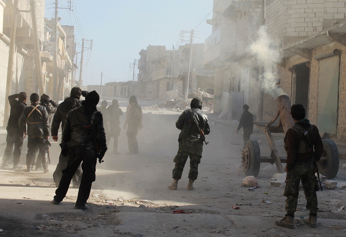 Members of the jihadist group Al-Nusra Front fire homemade mortar rounds during fighting with goverment forces on February 8, 2014 in the Syrian village of Aziza, on the southern outskirts of Aleppo. New aerial bombardment from explosives-packed barrel bombs in the northern Syrian city of Aleppo killed at least 20 people, the Syrian Observatory for Human Rights said. AFP PHOTO / BARAA AL-HALABI (Photo credit should read BARAA AL-HALABI/AFP/Getty Images)