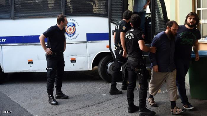 Turkish riot police officers escort suspected members of the Islamic State group at a hospital for a medical check-up on the second day of their custody on July 11, 2015 in Istanbul. Turkey on July 10 detained 21 suspected members of the Islamic State group, including three foreigners, in a major operation in several cities including Istanbul, state media said. The detainees are suspected of helping the jihadist group recruit people from Europe as well as helping them travel to Syria, the official Anatolia news agency said. AFP PHOTO / OZAN KOSE (Photo credit should read OZAN KOSE/AFP/Getty Images)