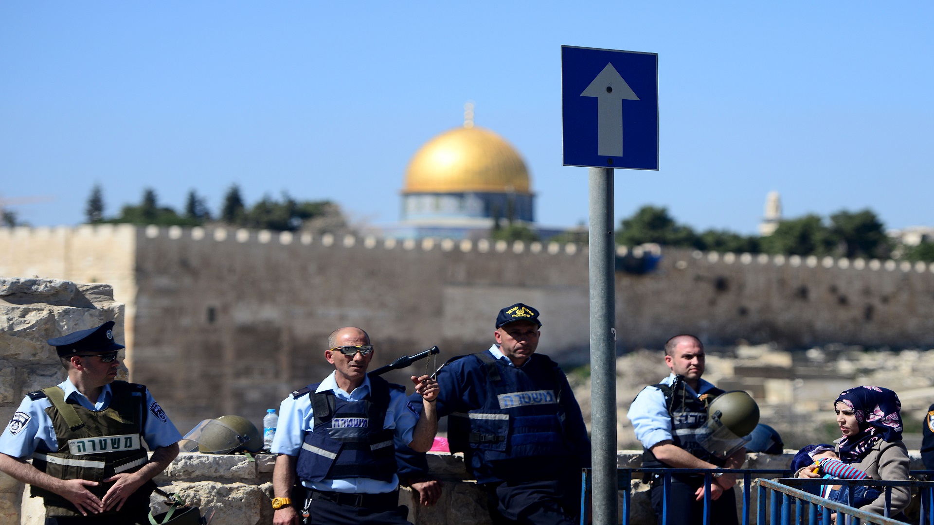 JERUSALEM, ISRAEL - FEBRUARY 27: Israeli forces arrested three Palestinians following Friday clashes in the city of Al-Quds on February 28, 2014. Thousands of Palestinians are forced to pray in the streets of Al-Quds on Friday after Israeli authorities restrict the entry of worshippers into the Al-Aqsa Mosque, the world's third holiest site for Muslims. (Photo by Salih Zeki Fazlioglu/Anadolu Agency/Getty Images)