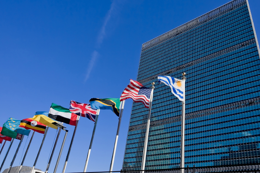 united nations building in nyc and flag poles