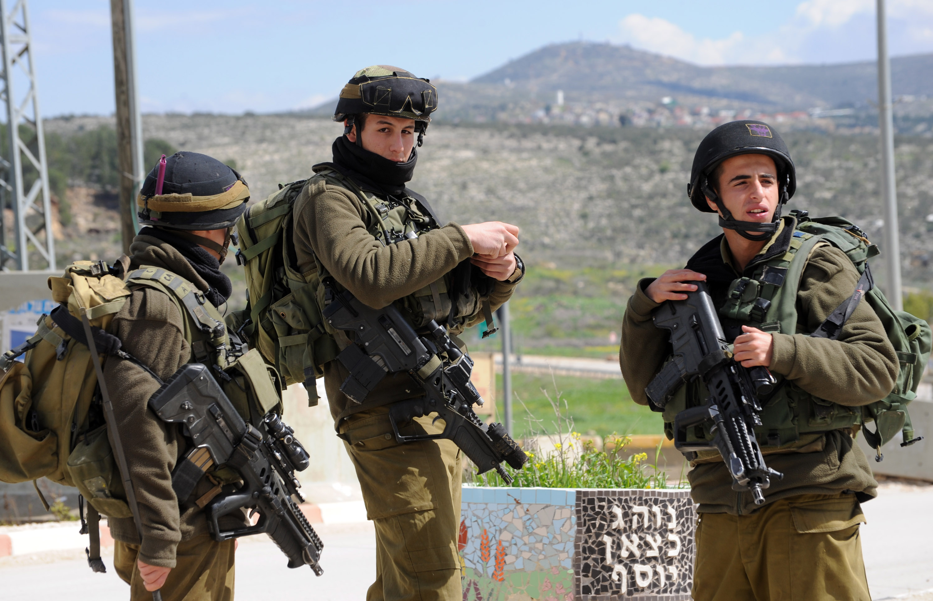 Israeli soldiers guard the road to the Israeli settlement Itamar, West Bank, where five family members were stabbed to death late Friday night by a Palestinian, March 12, 2011. A Palestinian infiltrated Itamar late Friday night, entering the settlers house through a window and stabbed the family to death while they slept. The victims are the parents and three of their children, including an infant. UPI/Debbie Hill