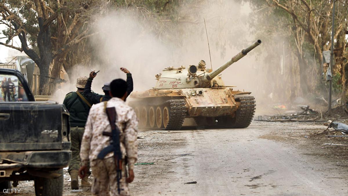Soldiers from the Libyan National Army, led by Marshal Khalifa Haftar, drive a T-62 tank, down a street in the Qawarsha sector, 10 kilometres (six miles) west of the centre of Benghazi, on November 18, 2016.
The armed forces led by Marshal Khalifa Haftar announced a "great victory" against jihadist fighters in Libya's second city of Benghazi. / AFP / Abdullah DOMA (Photo credit should read ABDULLAH DOMA/AFP/Getty Images)