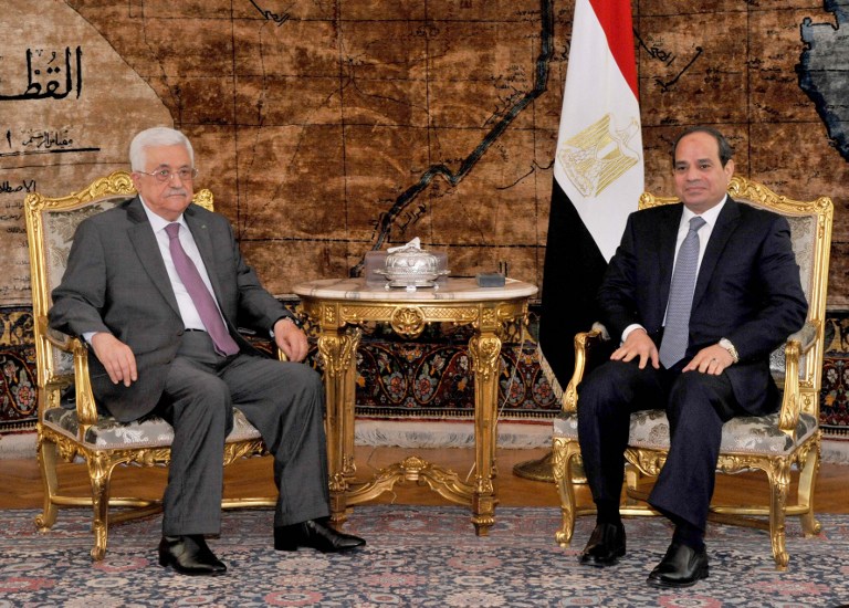 A handout picture released by the Egyptian Presidency on August 23, 2014, shows Egyptian President Abdel Fattah al-Sisi (R) meeting with Palestinian president Mahmud Abbas in Cairo. Egypt is to invite Israeli and Palestinian delegations to return to Cairo to resume talks on a long-term truce for Gaza, Palestinian president Mahmud Abbas announced. AFP PHOTO/ HO/ EGYPTIAN PRESIDENCY == RESTRICTED TO EDITORIAL USE - MANDATORY CREDIT "AFP PHOTO/HO/ EGYPTIAN PRESIDENCY" - NO MARKETING NO ADVERTISING CAMPAIGNS - DISTRIBUTED AS A SERVICE TO CLIENTS ==